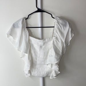 White ruffled boutique top (never worn)